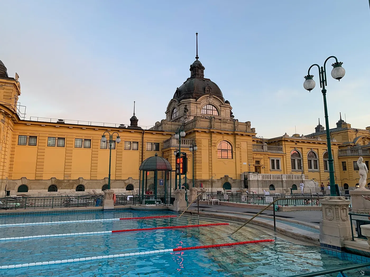 Outdoor pool and yellow Neo-Baroque facade of the Széchenyi Thermal Bath, Budapest