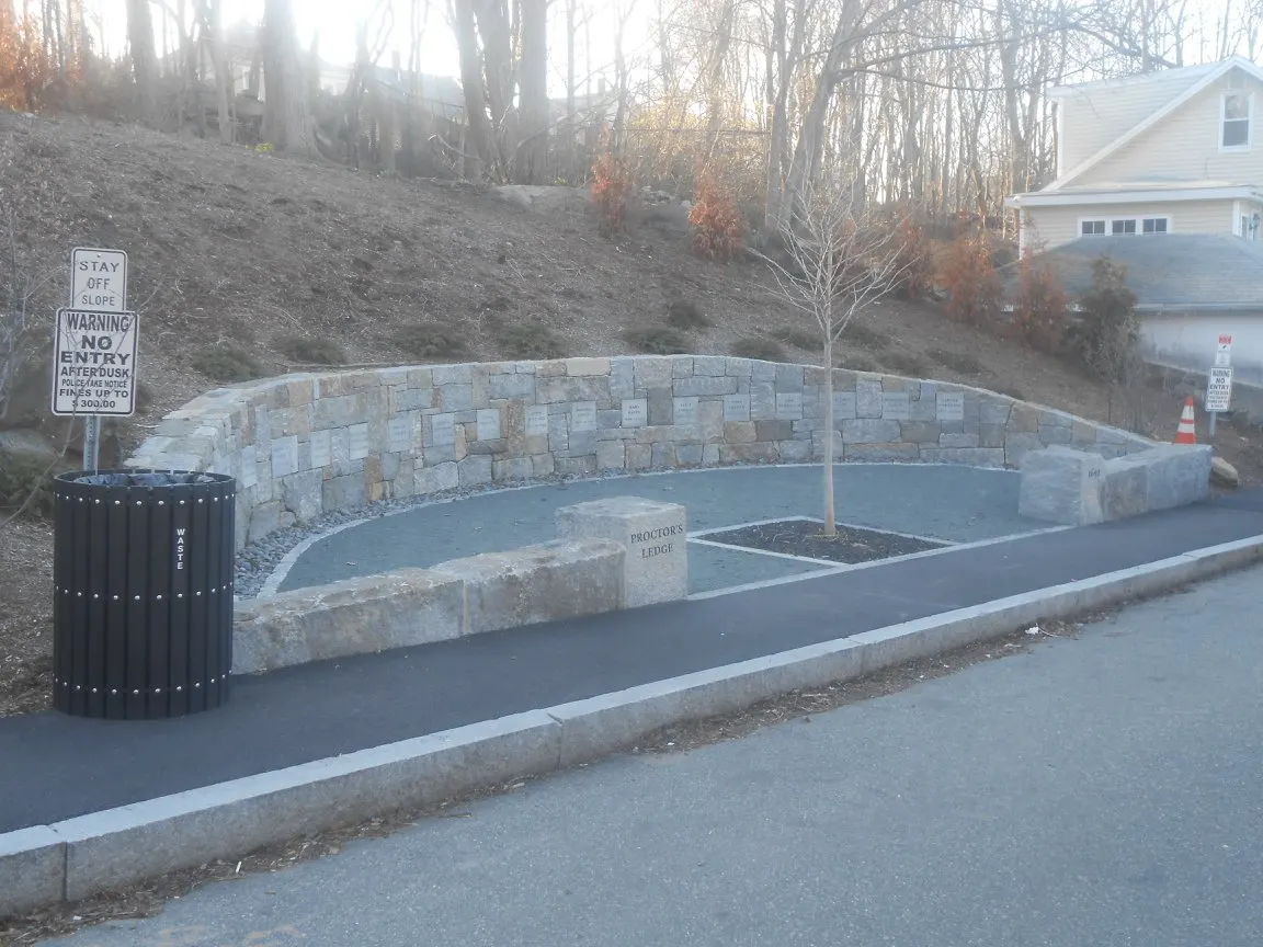 The stone memorial wall at Proctor's Ledge, Salem
