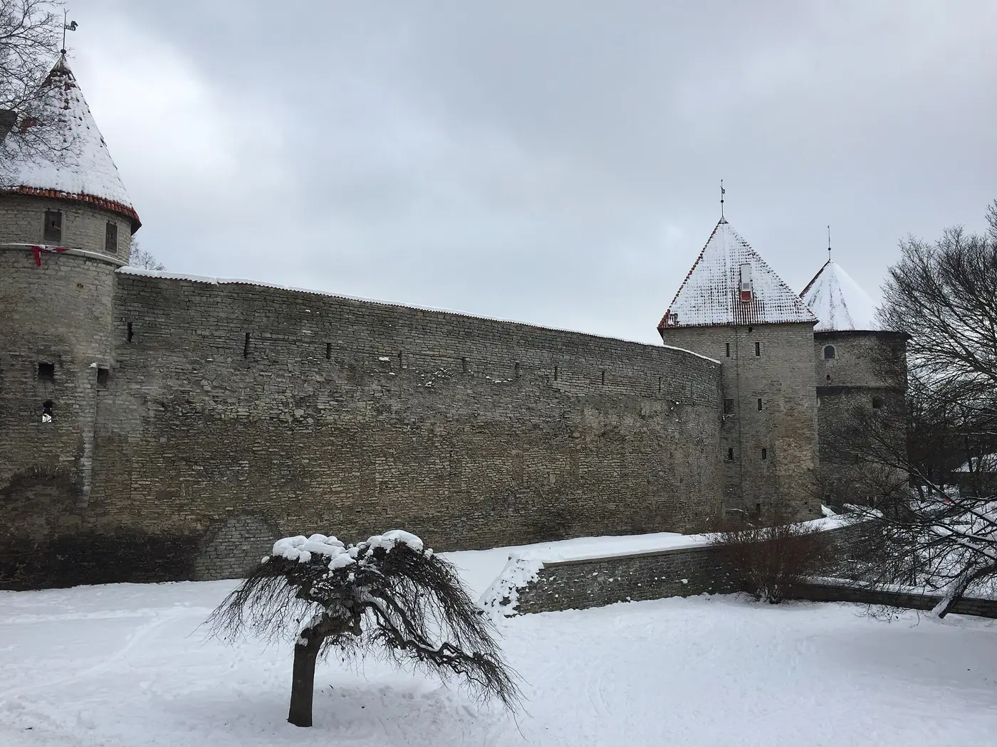 Medieval town wall and towers of Tallinn under fresh snow