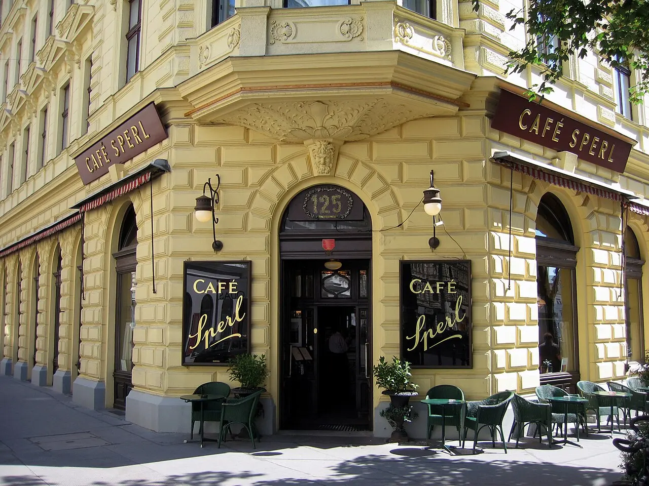 The yellow corner facade of Café Sperl, a classic Viennese coffee house
