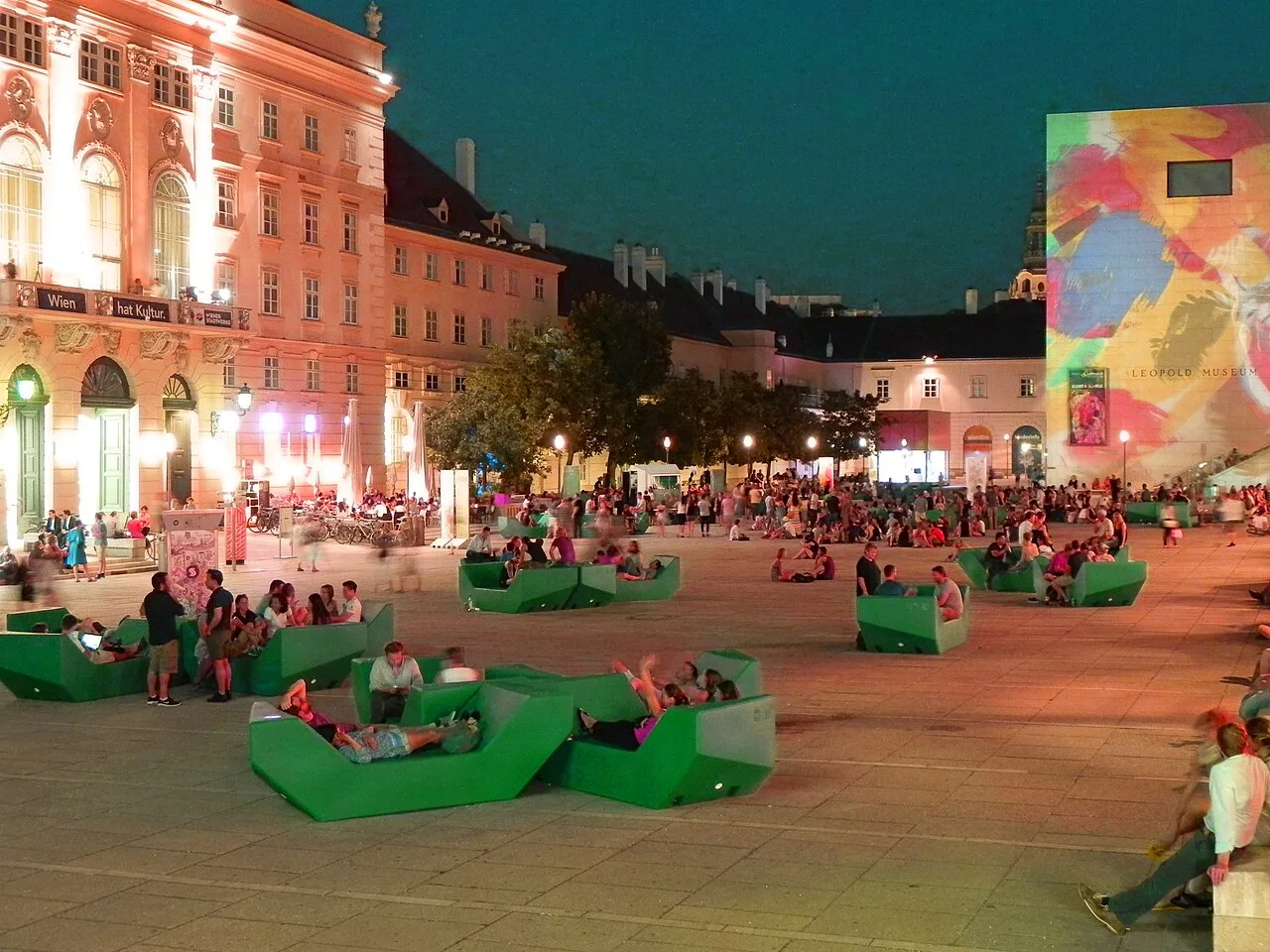 Evening in the MuseumsQuartier courtyard, with the Leopold Museum at right