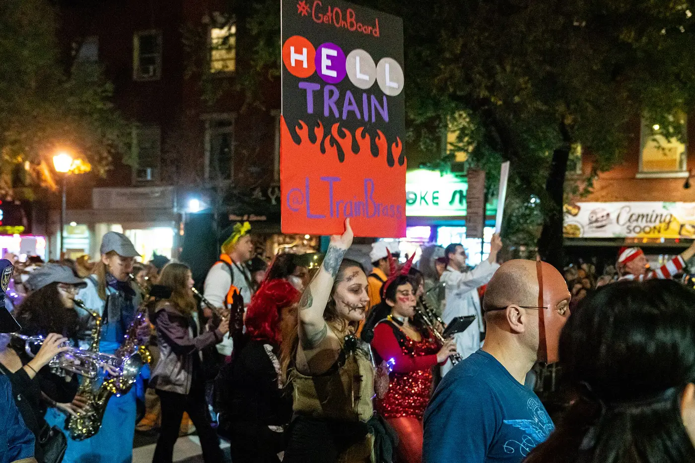 Costumed marchers and a brass band at the Village Halloween Parade, New York